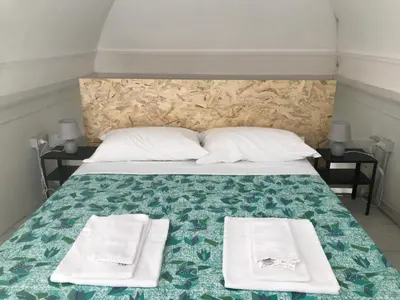 Letto o letti in una camera di AVAYA - Monolocale Soppalcato in Centro Storico