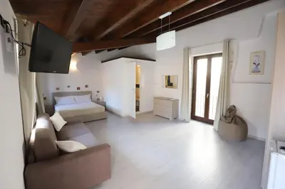 Letto o letti in una camera di Italiana Resort Atrio