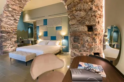 Letto o letti in una camera di BASTIÒ PRIVATE SUITES