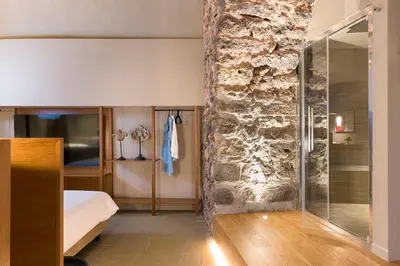 Letto o letti in una camera di BASTIÒ PRIVATE SUITES