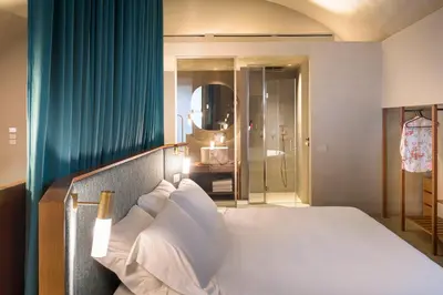 Letto o letti in una camera di BASTIÒ PRIVATE SUITES