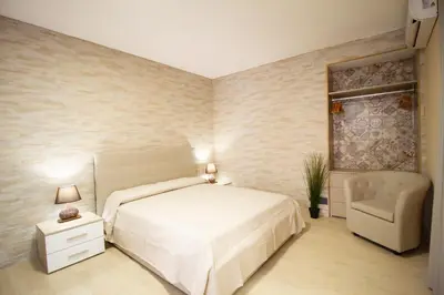 Letto o letti in una camera di Kleosuite Iris Opera Ortigia