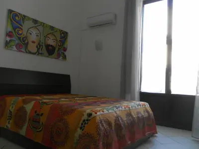 Letto o letti in una camera di Casa Catania Inn