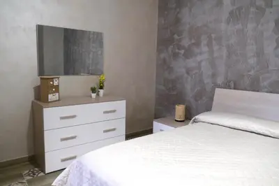 Letto o letti in una camera di Sweet House Melania