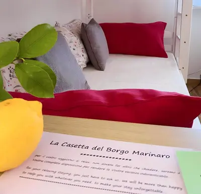 Letto o letti in una camera di La Casetta del Borgo Marinaro
