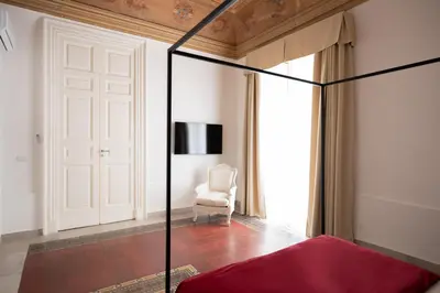 Letto o letti in una camera di B. Sicilian Charming Stay Historical Suite