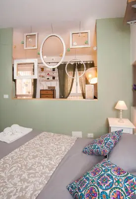 Letto o letti in una camera di Homes4Holidays - Artistic Nest
