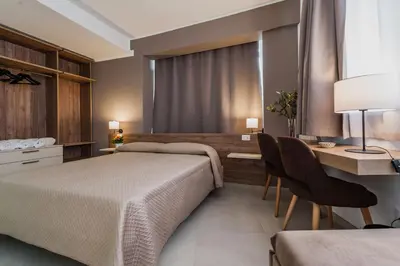 Letto o letti in una camera di Archimede's Rooms