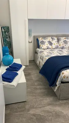 Letto o letti in una camera di LA PERLA BLU DI FONTANE BIANCHE