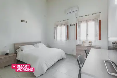 Letto o letti in una camera di Modern duplex with balcony by Wonderful Italy