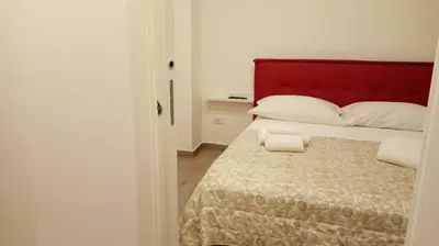 Letto o letti in una camera di Home Dante