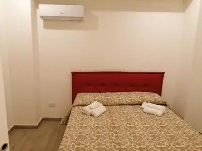 Letto o letti in una camera di Home Dante
