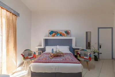 Letto o letti in una camera di Elsa d'Ortigia