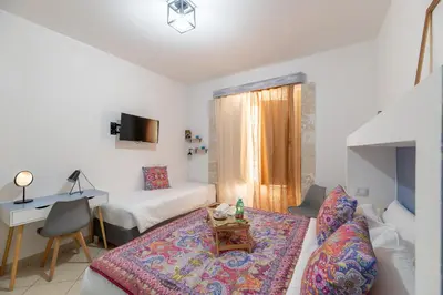 Letto o letti in una camera di Elsa d'Ortigia