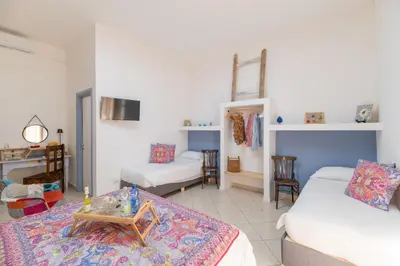 Letto o letti in una camera di Elsa d'Ortigia