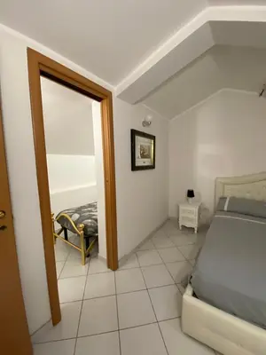 Letto o letti in una camera di Home Pino Center~600 mt Duomo CT