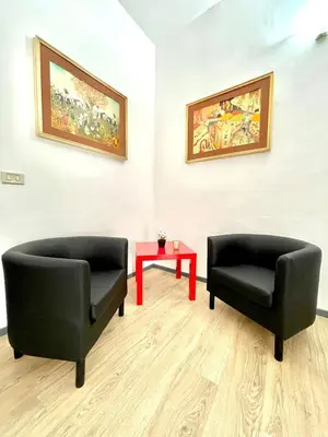 Area soggiorno di Gesuiti Rooms Catania