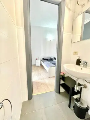 Letto o letti in una camera di Gesuiti Rooms Catania