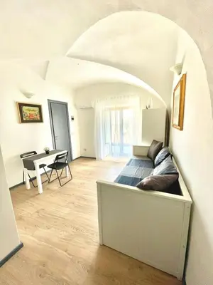 Area soggiorno di Gesuiti Rooms Catania