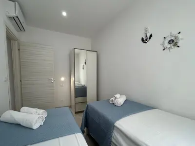 Letto o letti in una camera di Sunlands 50 meters from the sandy beach with wifi