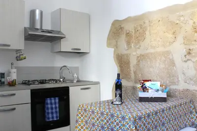Cucina o angolo cottura di Terrace- Walk to Porta Reale and Cafes - La Casa della Pietra - Near Wine Tasting
