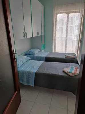 Letto o letti in una camera di casa Simona