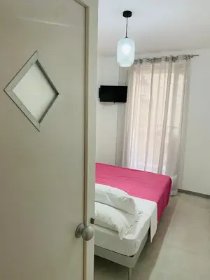 Letto o letti in una camera di Casa 68 Ortigia