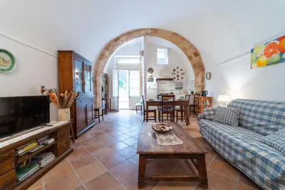 Area soggiorno di GuestHost - Gli Archi di Ortigia - Cala Rossa Cozy Apartment