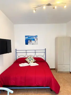 Letto o letti in una camera di Mini House Catania Historic center