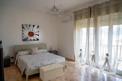Letto o letti in una camera di Da DOMITILLA in centro storico con panorama