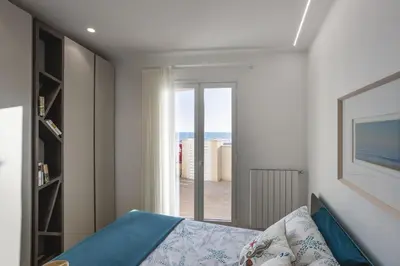 Letto o letti in una camera di ISULATRAVEL - House on the beach Piano Terra