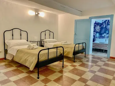 Letto o letti in una camera di ortigia 116