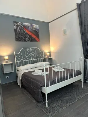 Letto o letti in una camera di Etna Rooms