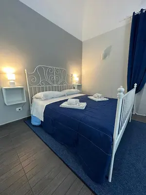 Letto o letti in una camera di Etna Rooms