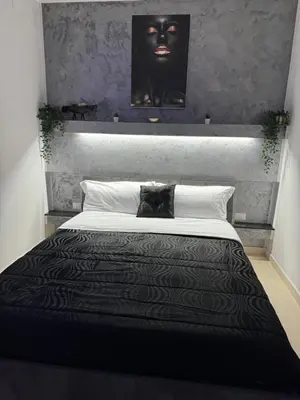 Letto o letti in una camera di Il cortiletto28 Rooms & House