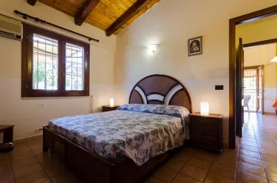 Letto o letti in una camera di Villa Nina