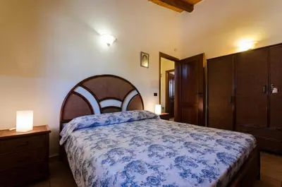 Letto o letti in una camera di Villa Nina