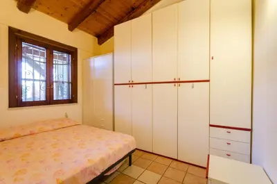 Letto o letti in una camera di Villa Nina