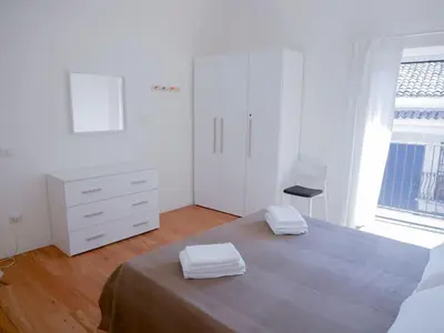 Letto o letti in una camera di Ai banchi Apartment