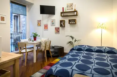 Letto o letti in una camera di Gli Appartamenti al Duomo