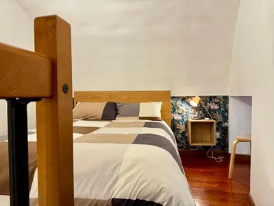 Letto o letti in una camera di Gli Appartamenti al Duomo