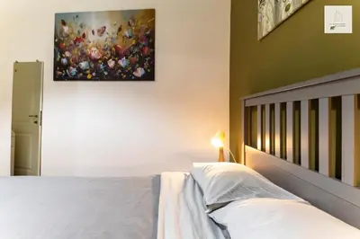 Letto o letti in una camera di Gli Appartamenti al Duomo