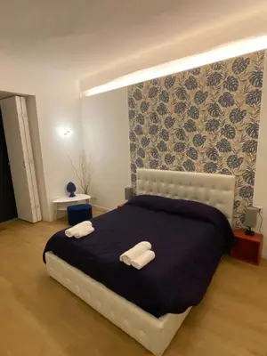 Letto o letti in una camera di Casa accanto teatro