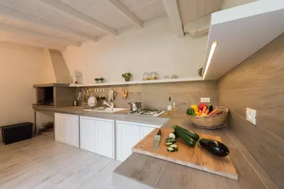 Cucina o angolo cottura di ISULATRAVEL - Villa Le Palme