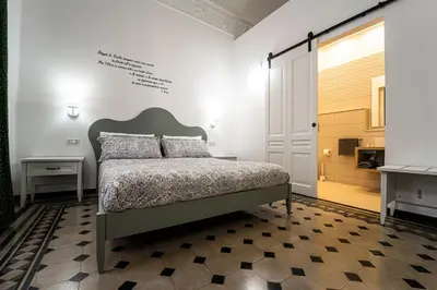 Letto o letti in una camera di Gli specchi di Archimede
