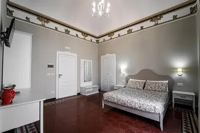 Letto o letti in una camera di Gli specchi di Archimede