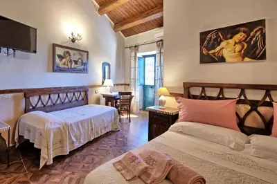 Letto o letti in una camera di Villa Maddalena by PosarelliVillas