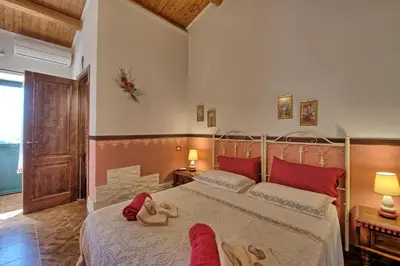 Letto o letti in una camera di Villa Maddalena by PosarelliVillas