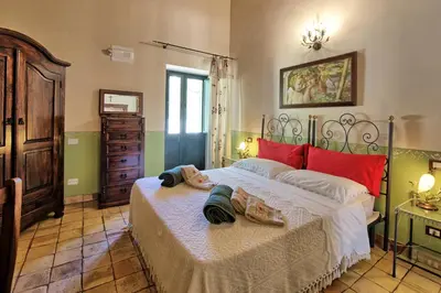 Letto o letti in una camera di Villa Maddalena by PosarelliVillas