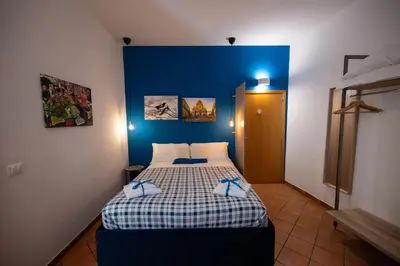 Letto o letti in una camera di Bnb San Barnaba
